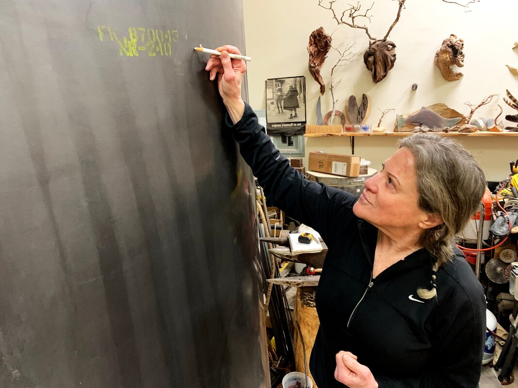 Jill Drllevich creating a nuclear sculpture for Blades of Change