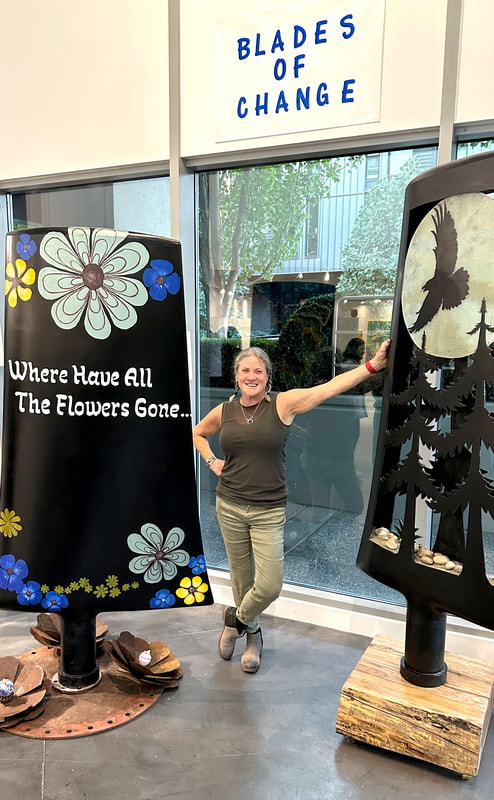 Jill Drllevich with her nuclear fan blade sculptures at the Fishbowl Gallery